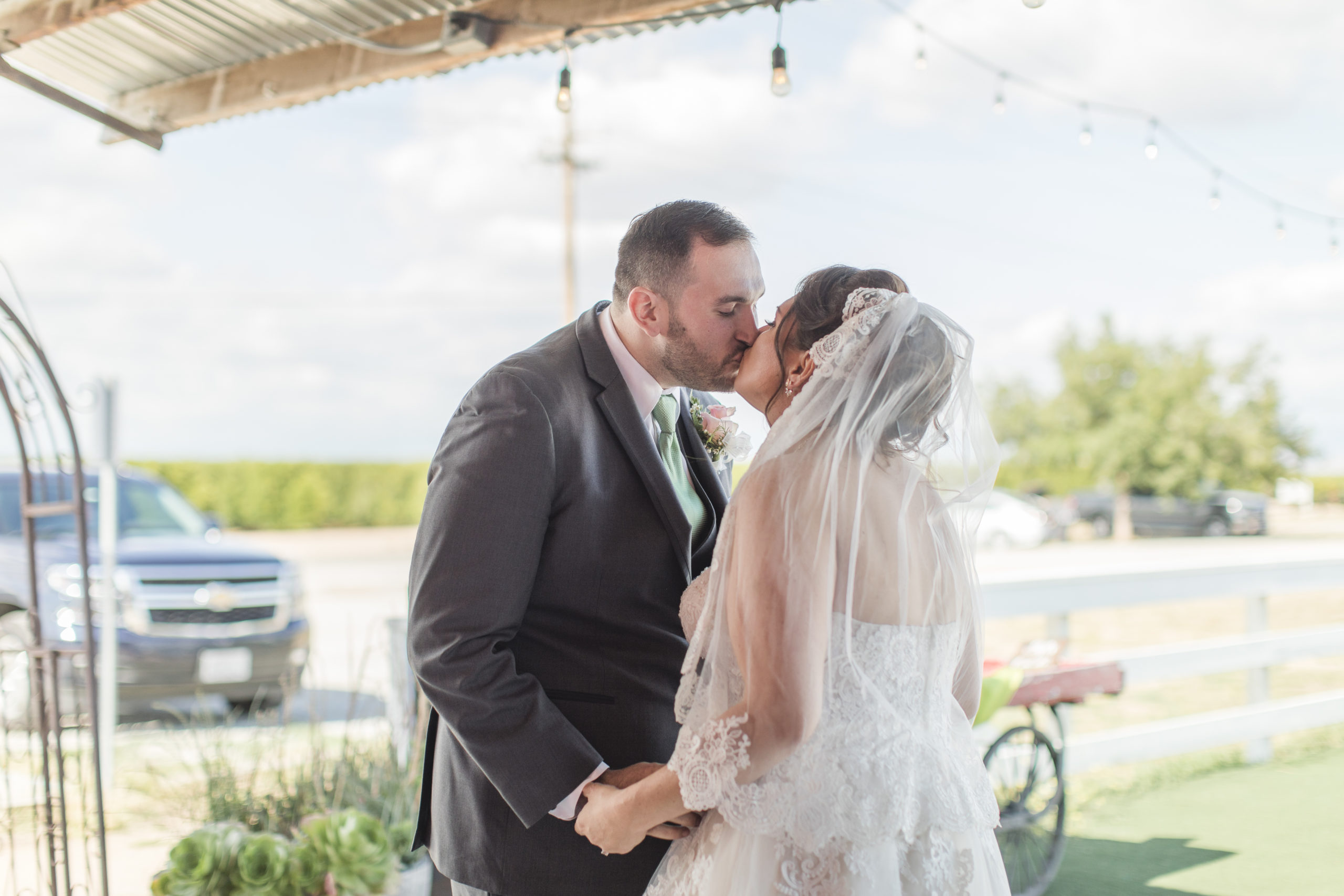 A teal Branch and Vine Wedding first look