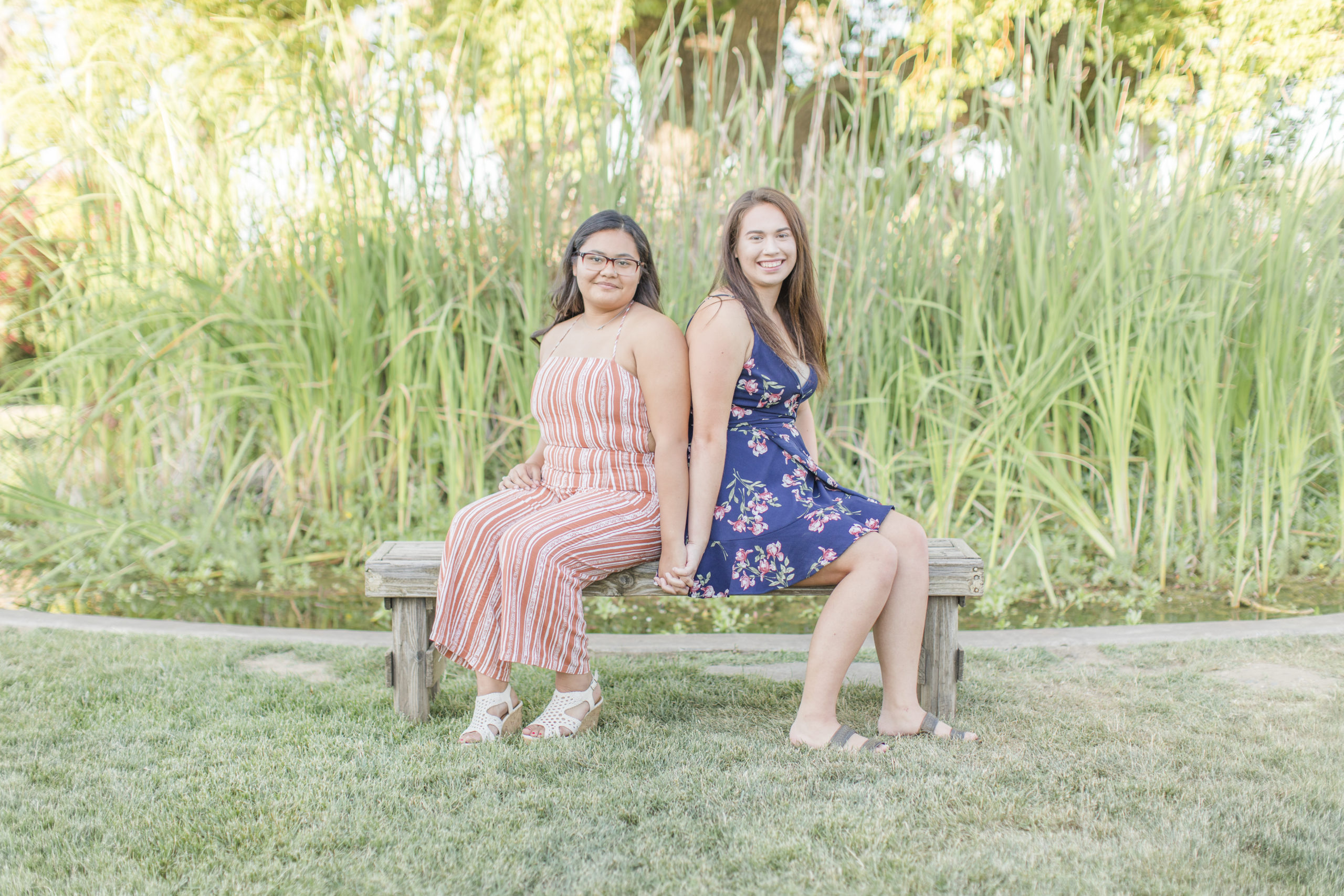 Senior girls posing on bench