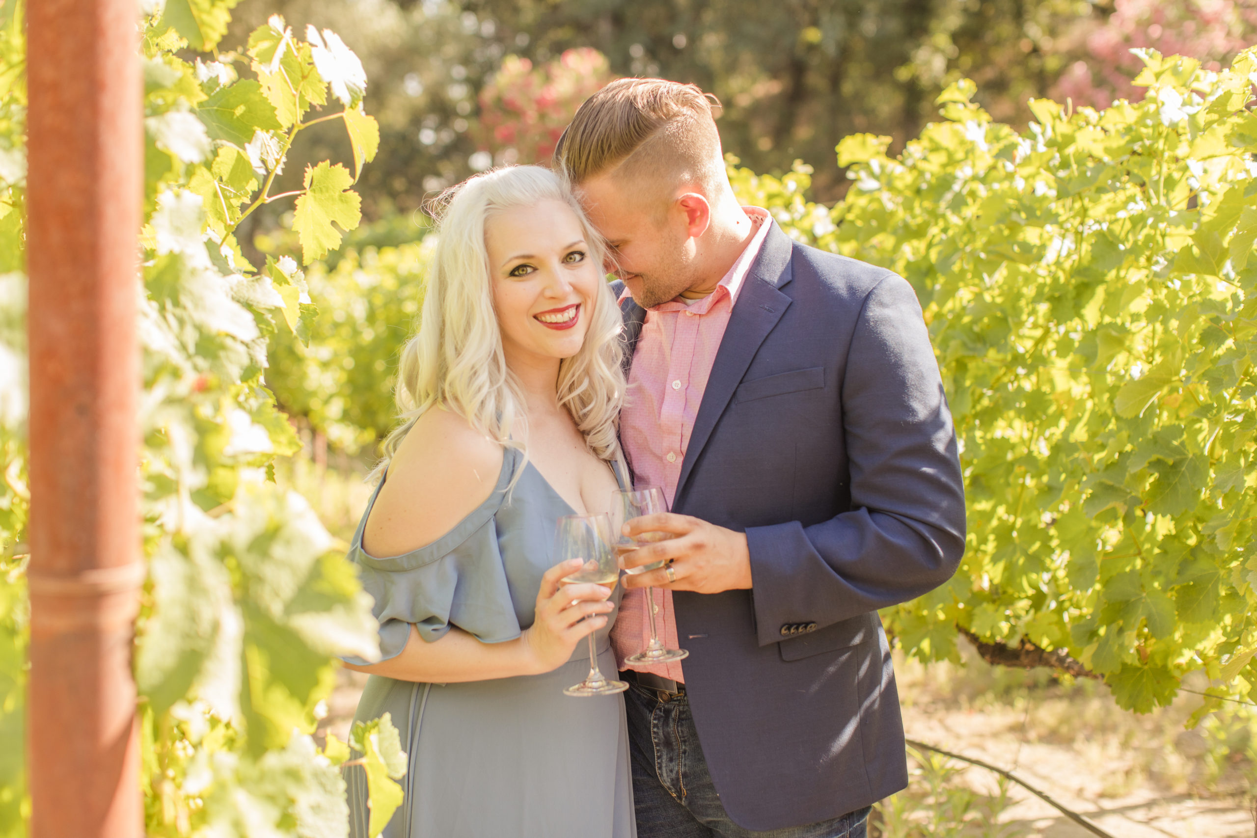 couple posing at winery