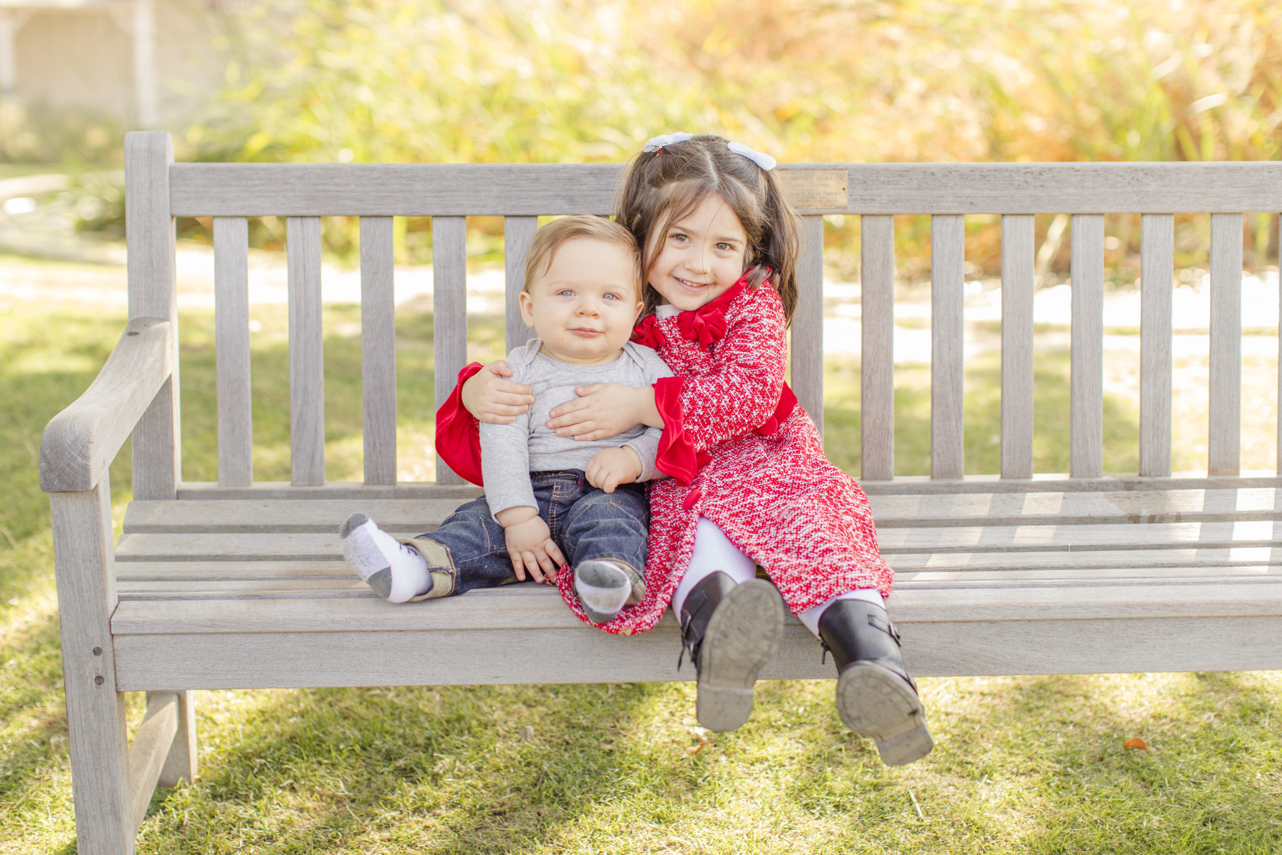 brother and sister on bench