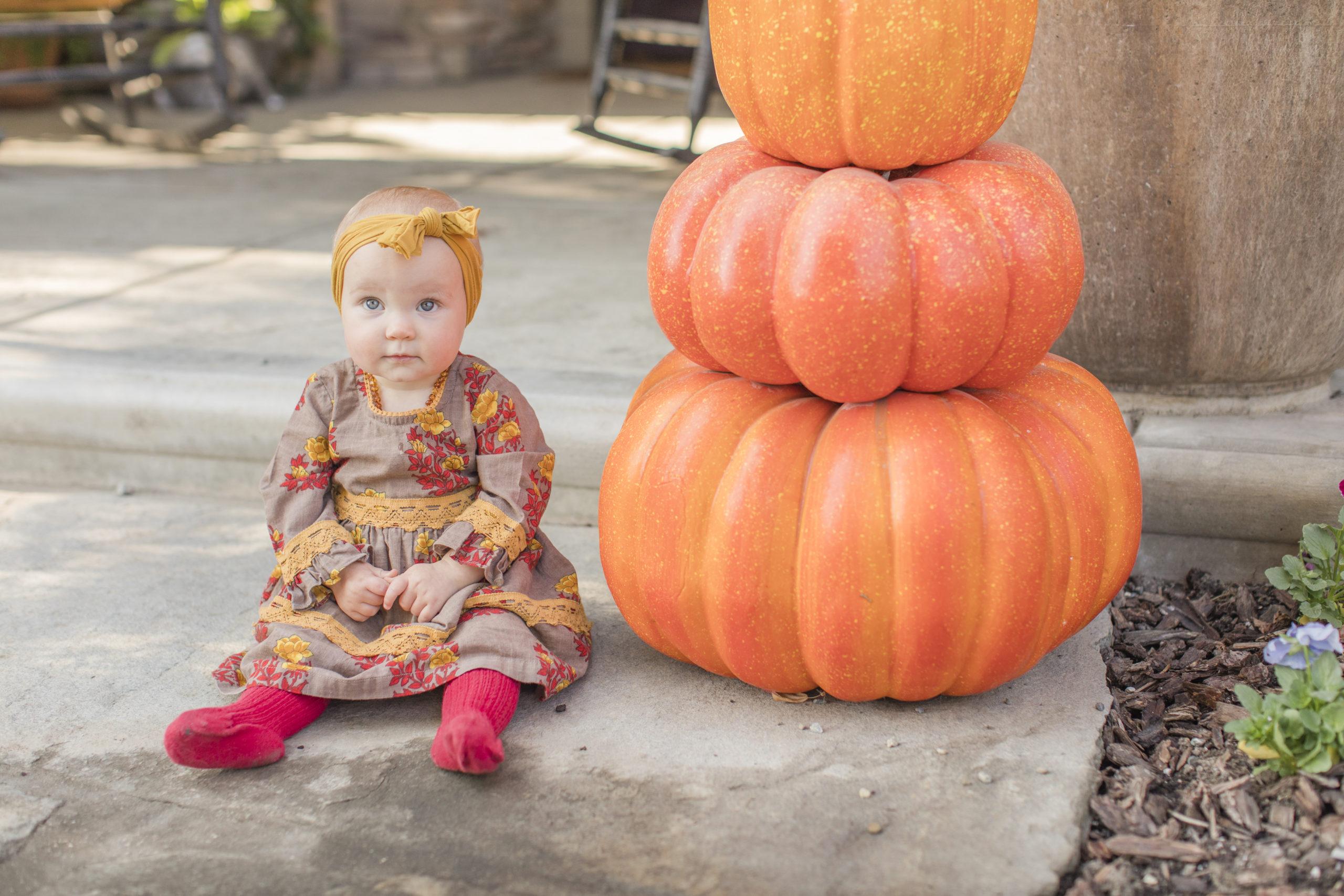 first year milestone  girl with pumpkins