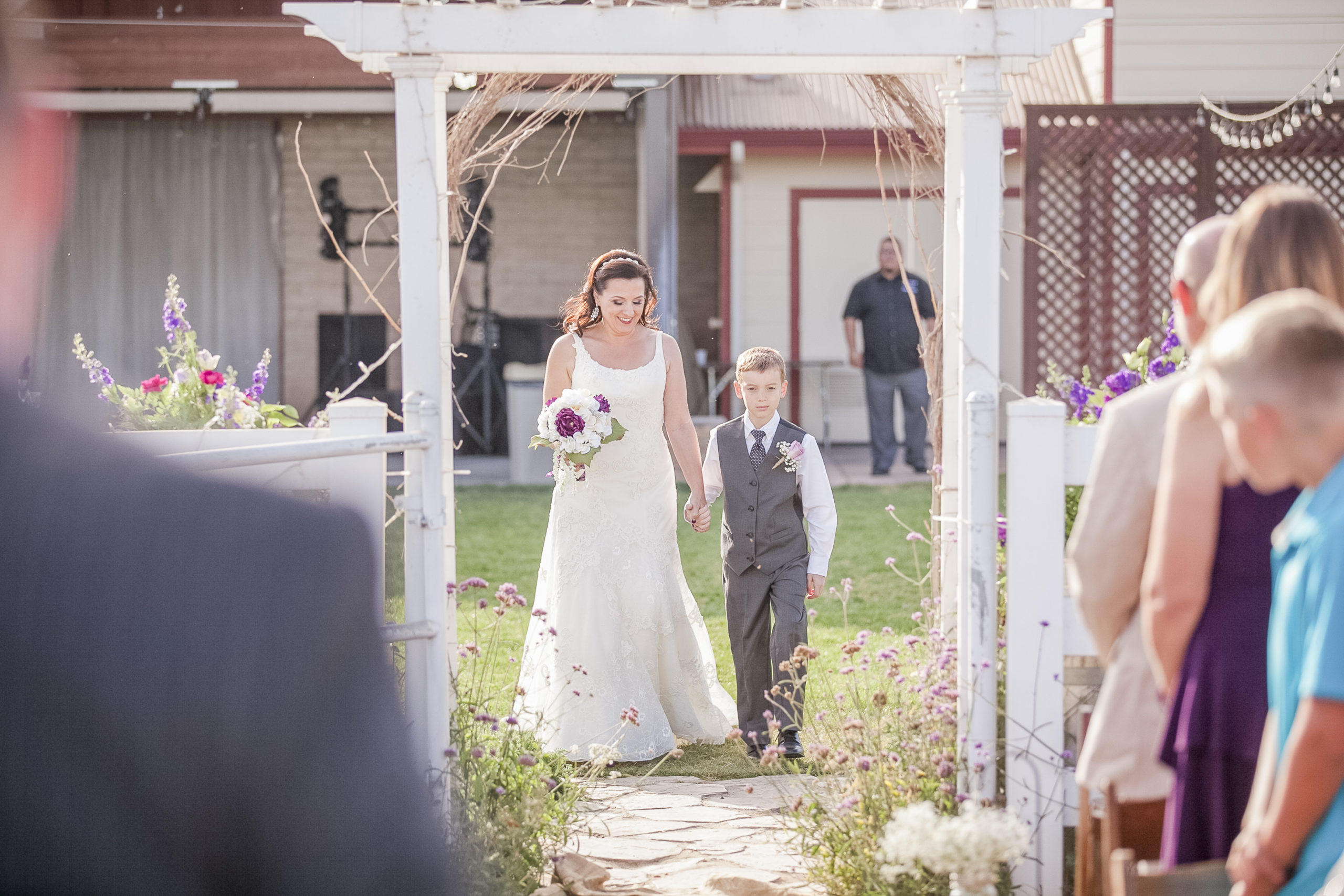 bride with son walking down aisle