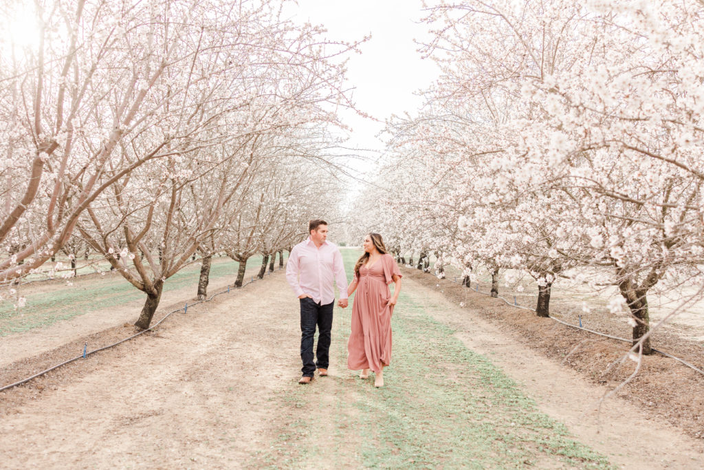 Couple in blossom trees on the blossom trail
