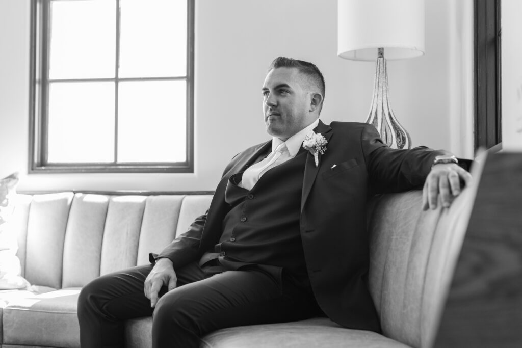groom sitting on a couch
