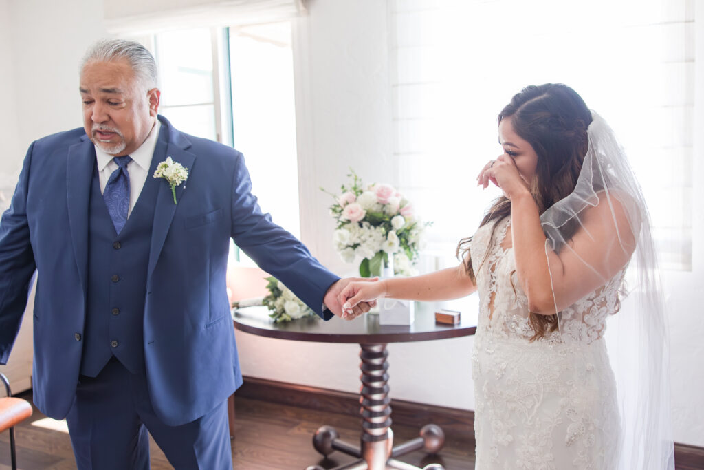father of bride with bride crying