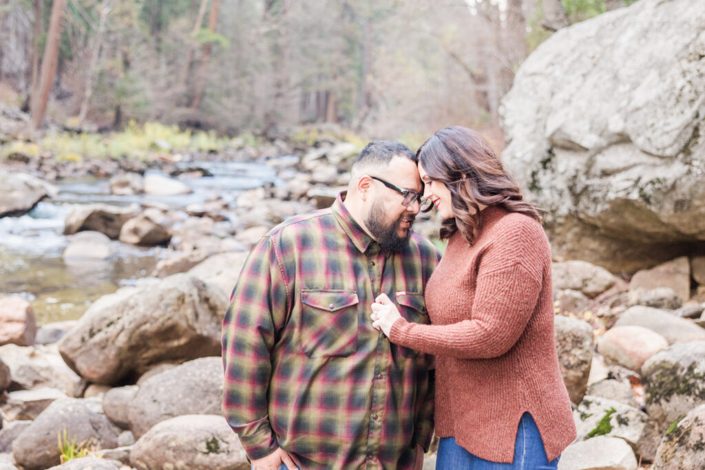 yosemite valley engagement couple by river